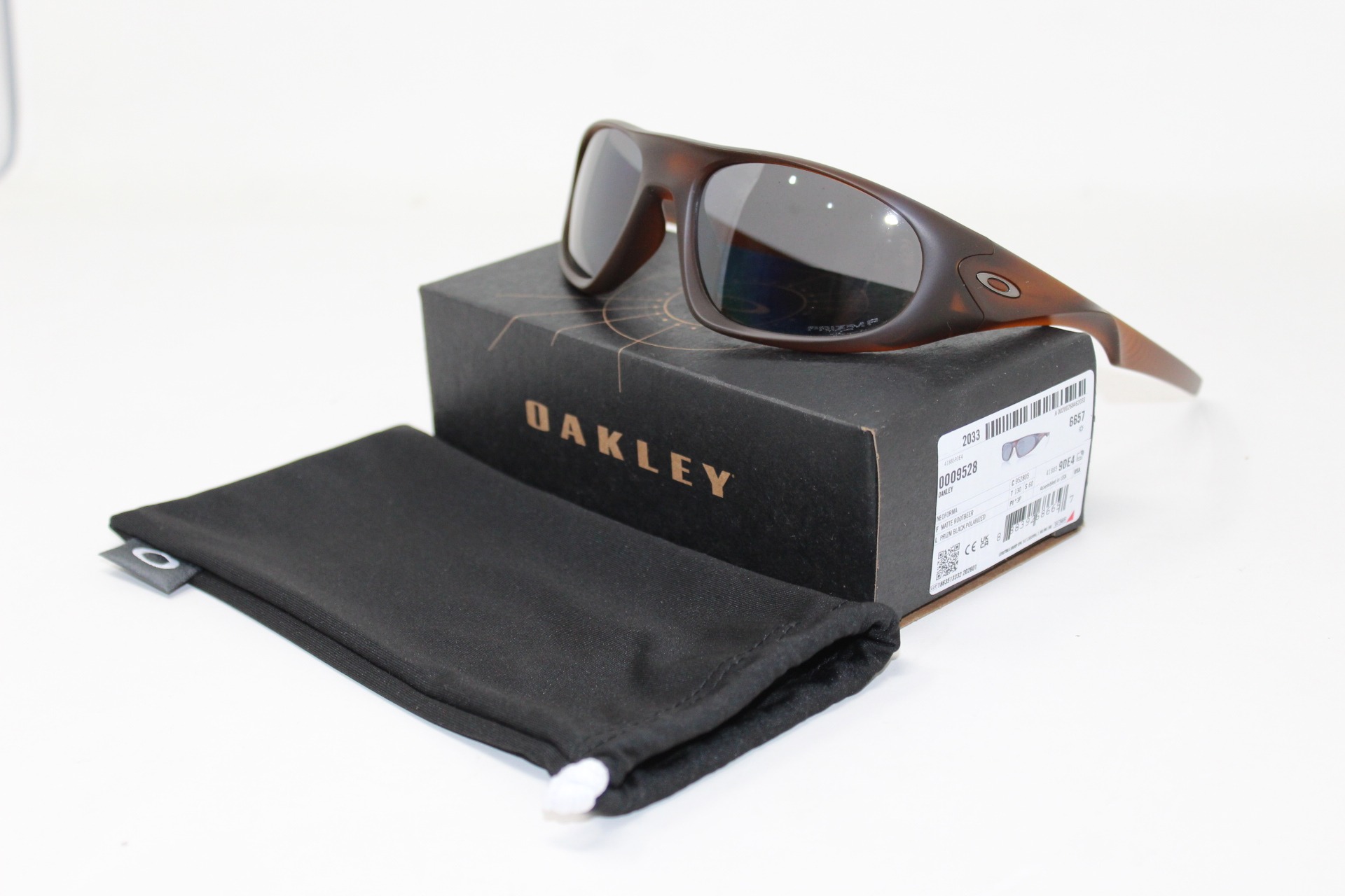Oakley-Neoforma-Matte-Rootber-Prizm-Black-Polarizadas-Eyewearlocker-Oakley-Ecuador-1
